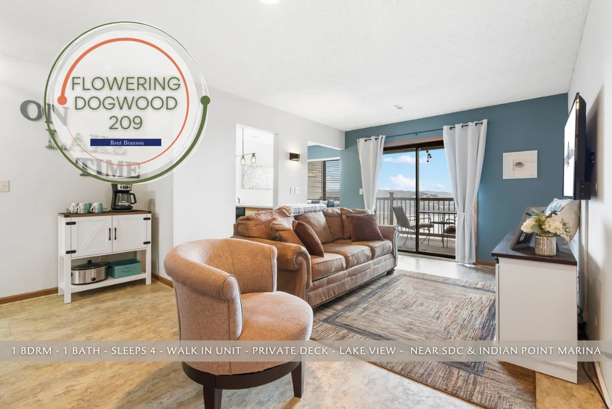 A bright, modern living space featuring a sofa, armchair, coffee table, and expansive lake view through the window. The scene invites relaxation with family and hints at enjoying peaceful moments together after active days exploring and playing.